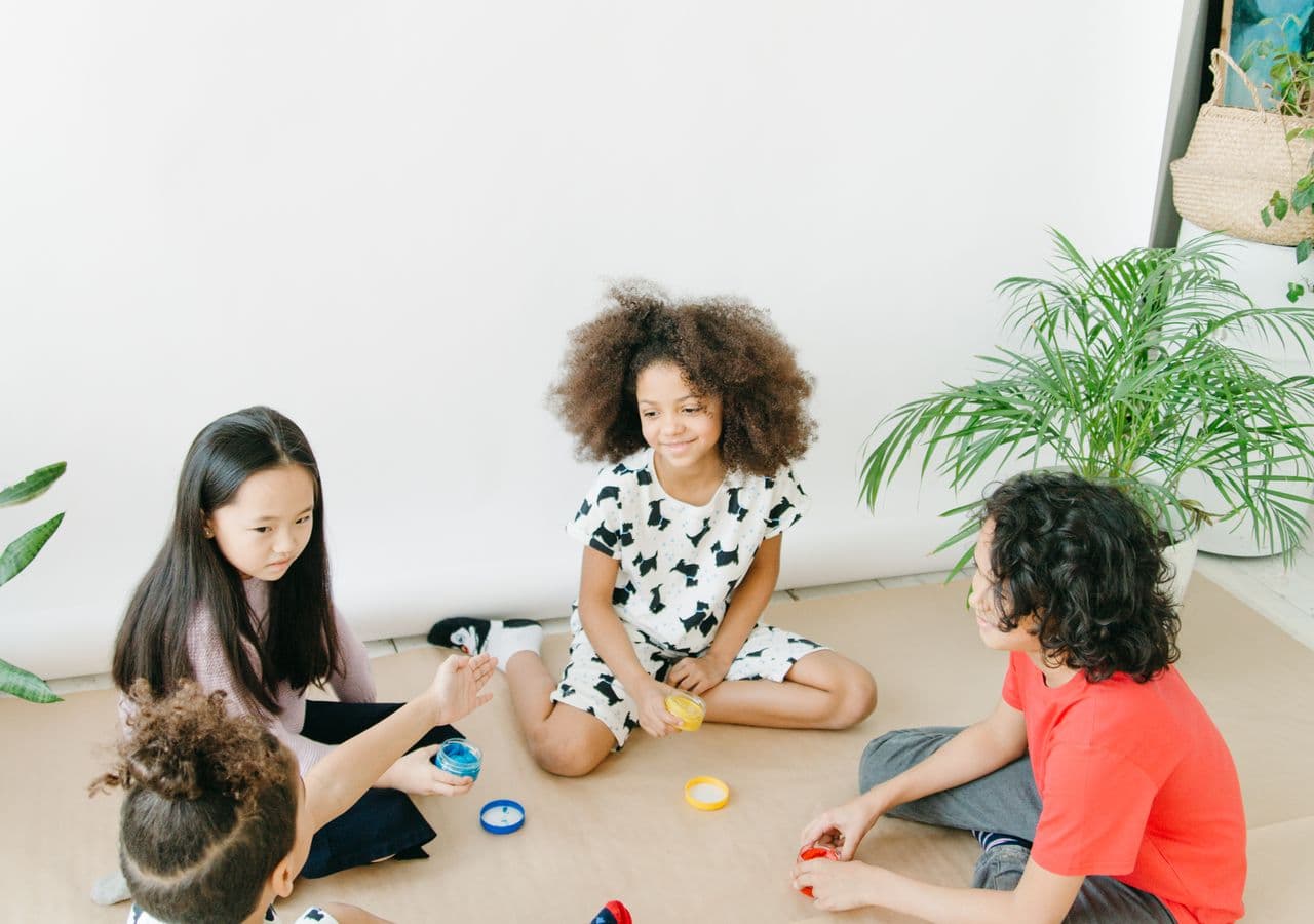 Children and educators sharing a group activity at a childcare center