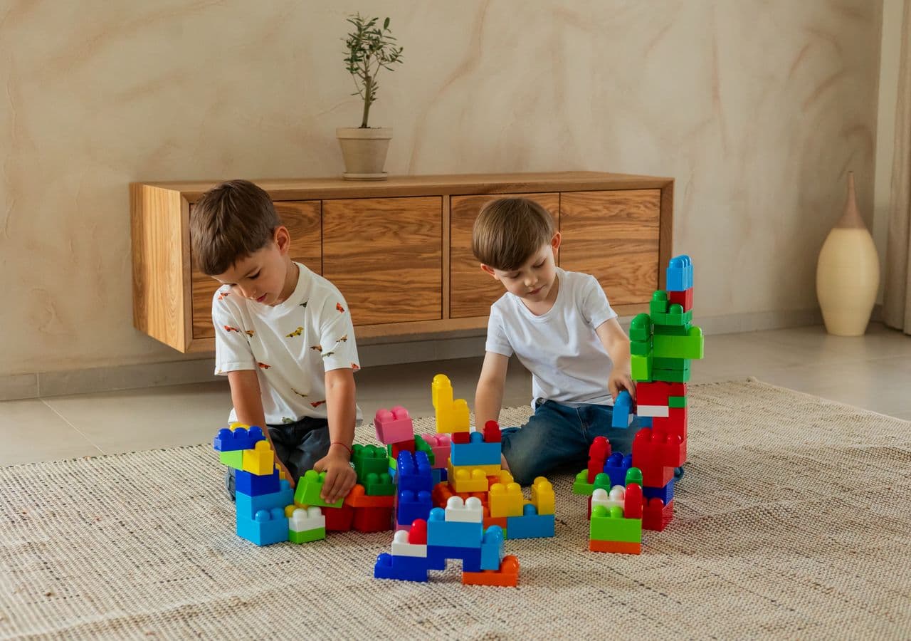 Educator and children playing with building blocks at a childcare center